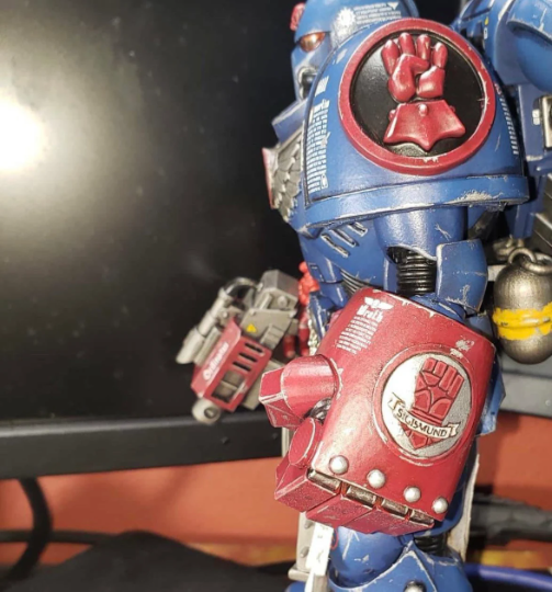 Painted as a Crimson Fist the Imperial Fist Legion MKIV Shoulder Pad on McFarlane Toys Ultramarines Space Marines from Fantasy World Games