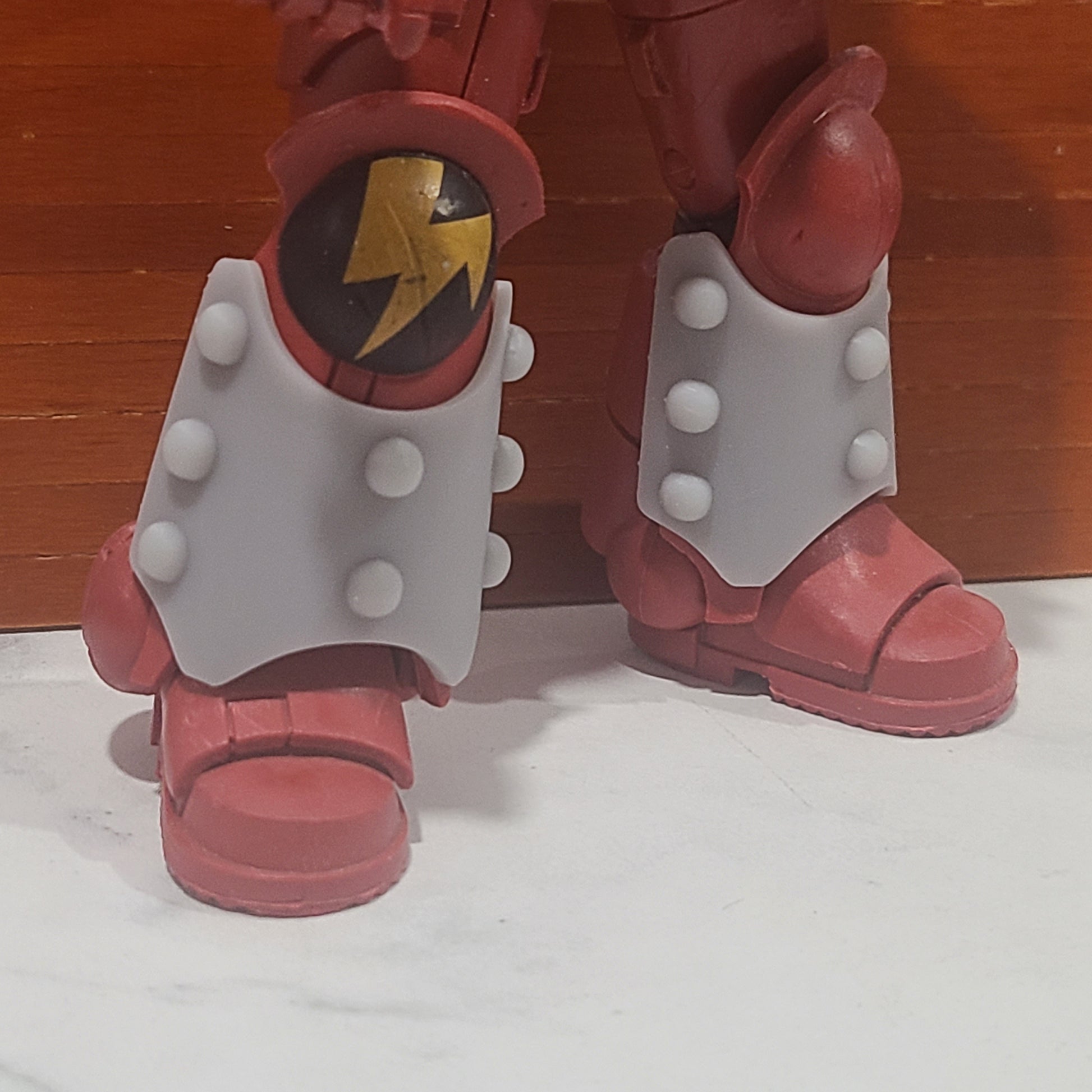 Shin Guard Armor Decal with Molecular Bonding Studs on a Blood Angels Angle