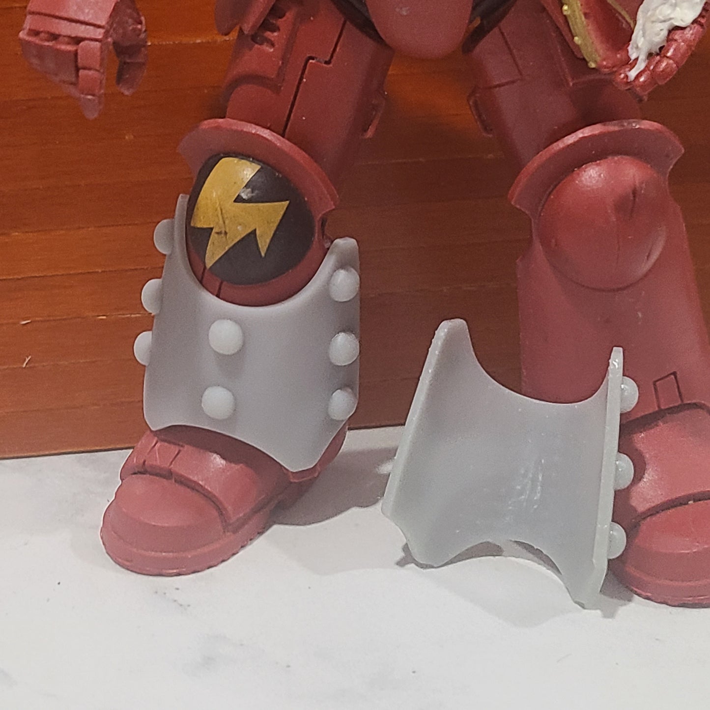 Shin Guard Armor Decal with Molecular Bonding Studs on a Blood Angels Front and Back