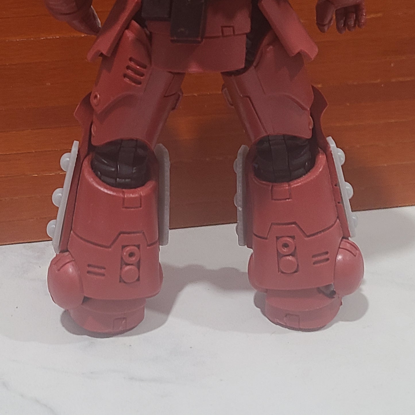 Shin Guard Armor Decal with Molecular Bonding Studs on a Blood Angels