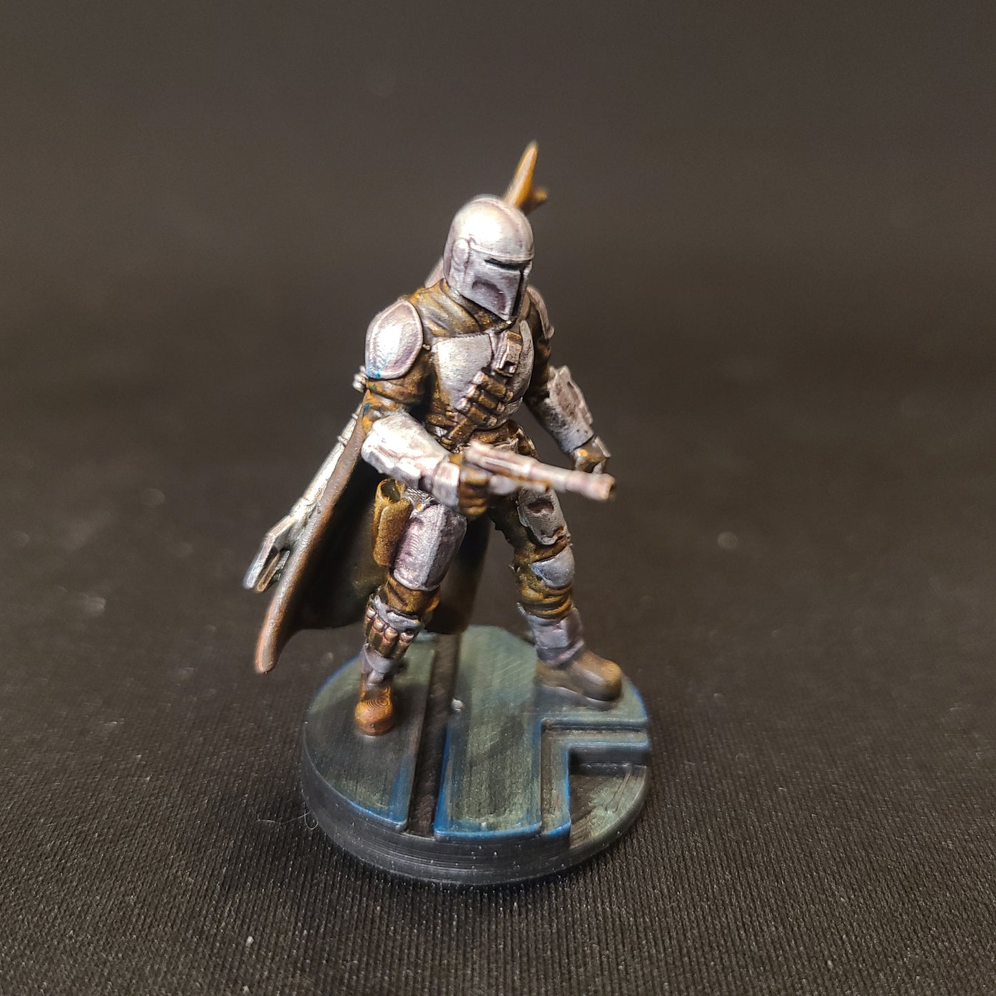 The Mandalorian posed with IB-94 blaster pistol pointed forward Bounty Hunter is Compatible with Star Wars Legion painted by MLBStudios Side profile