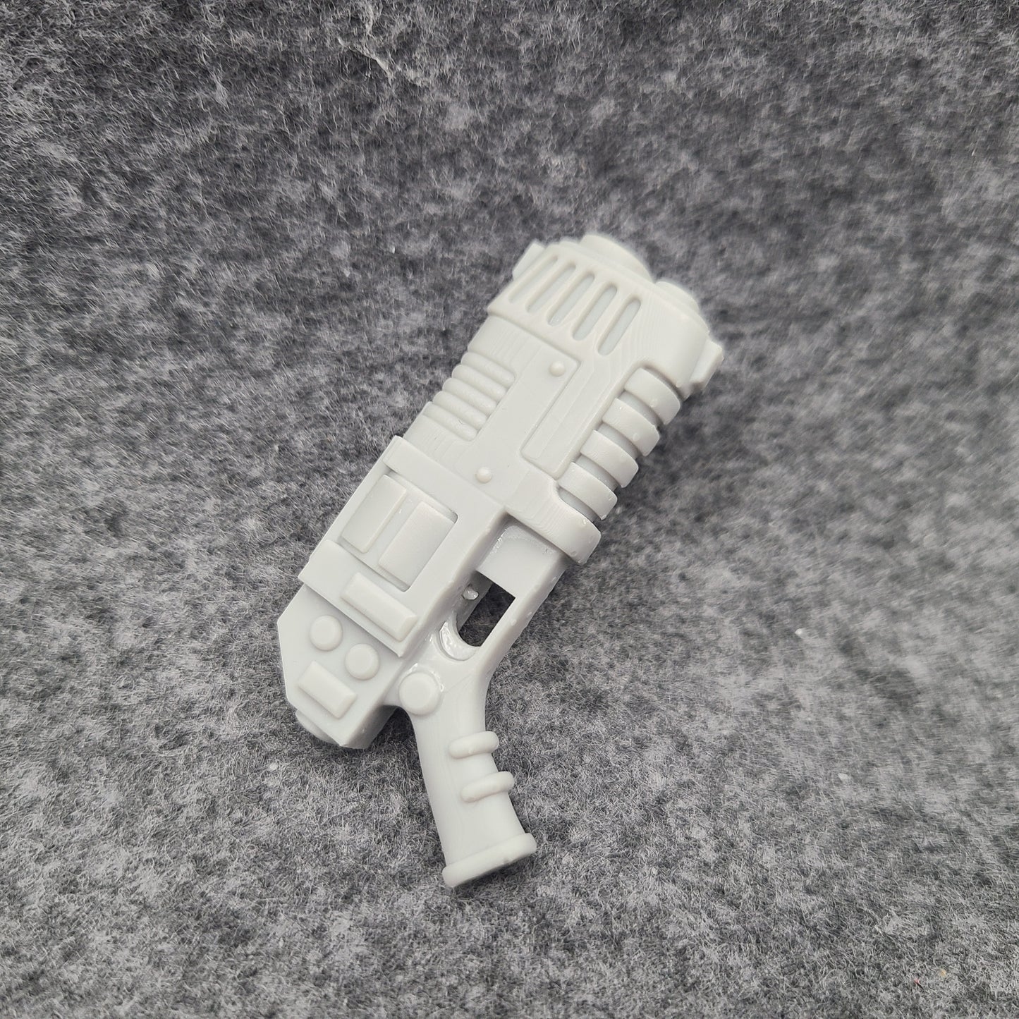Custom resin plasma pistol revolver compatible with McFarlane Toys 7-inch 1:12 scale armored action figures.