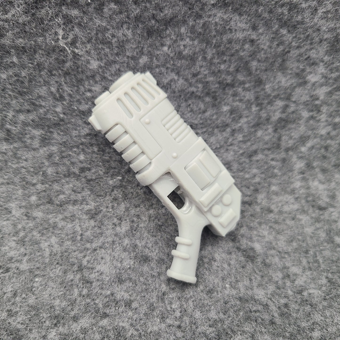 Custom resin plasma pistol revolver compatible with McFarlane Toys 7-inch 1:12 scale armored action figures.