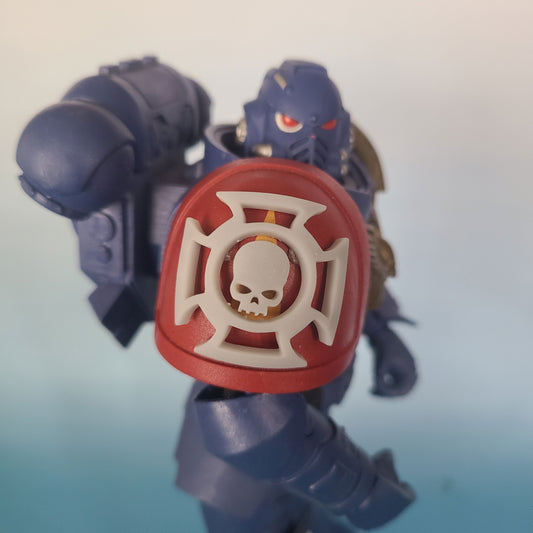 Custom resin veteran shoulder pad iconography compatible with McFarlane Toys 7-inch 1:12 scale armored action figures.